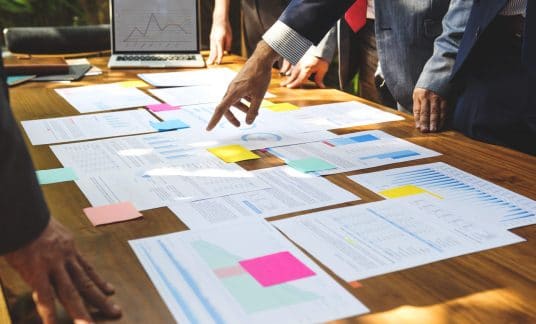 Coworkers review business plans during a meeting