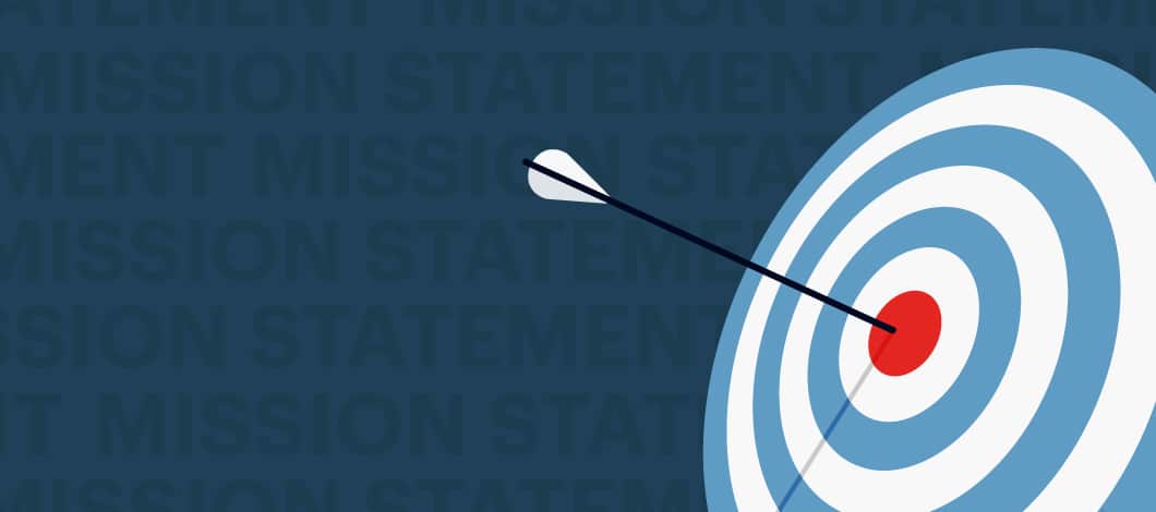 An arrow rests in the bullseye of an archery target.