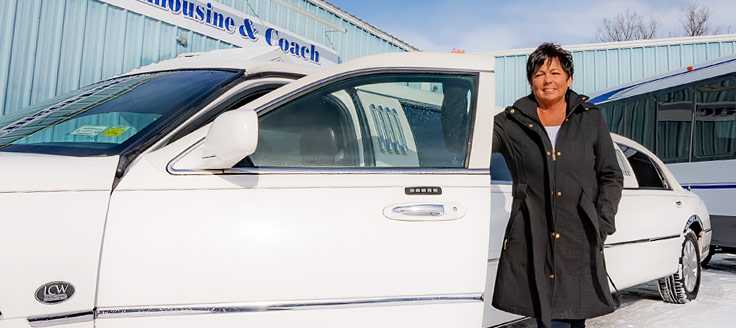 Woman standing in front of limo