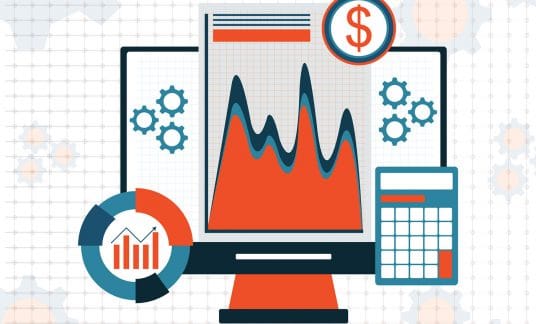 Computer monitor showing graphs of growth and money.