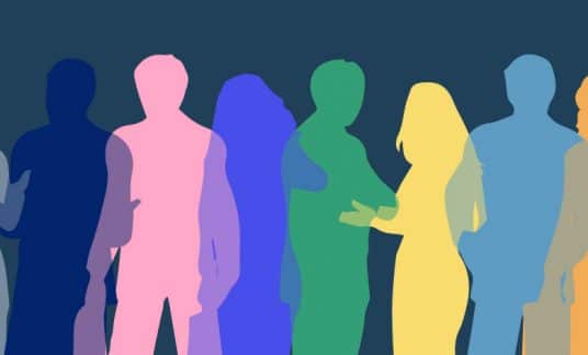 Silhouettes of men and women in an array of rainbow colors represent diversity in this concept illustration.