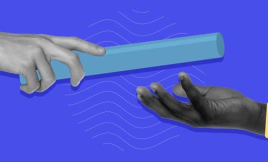 One hand is passing a baton to another hand amid a blue background