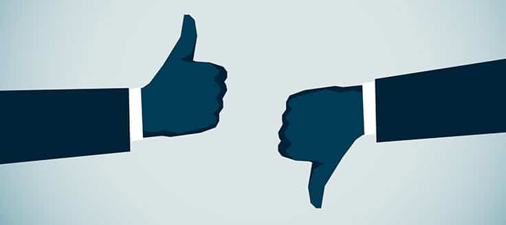 Illustration of one person giving the thumbs up and another person giving the thumbs down. 