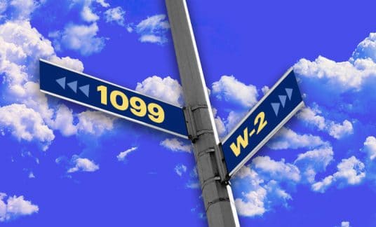 Street post with one address sign that says 1099 facing one way and another with W-2 facing another with a blue sky and clouds above