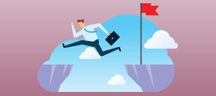 A man in a business suit leaps from one cliff to another. A loan broker can help your business through lending hurdles.