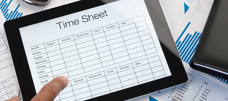 A person works with their time sheet from a tablet screen.