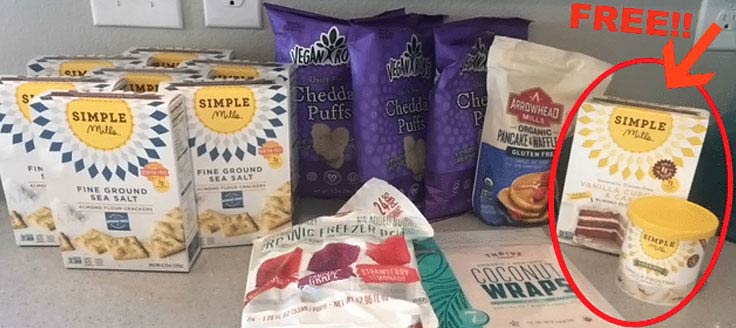 Boxes and bags of food from Thrive Market are displayed on a kitchen counter.