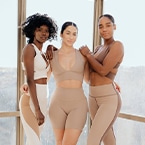 A photo of 3 women posing in Solely Fit’s athletic wear.