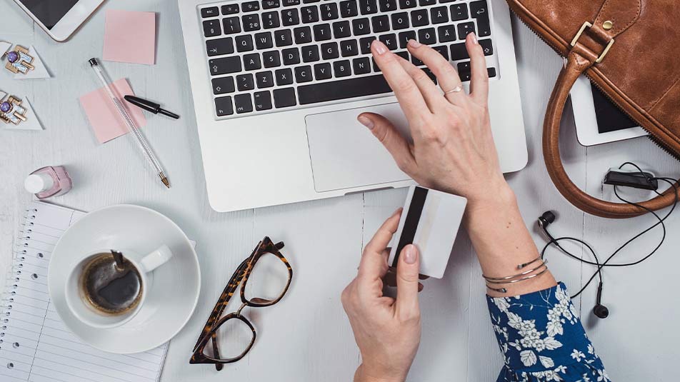 A woman makes credit card purchases for her business.