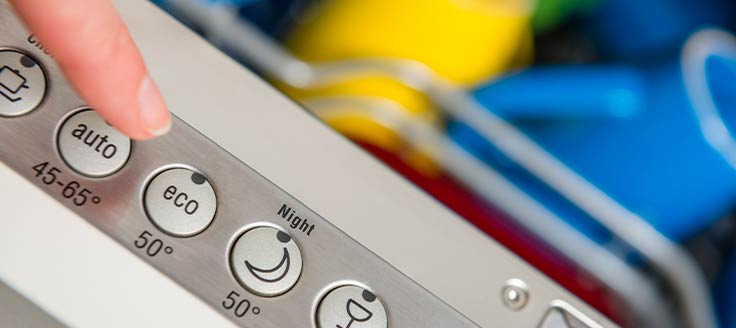 A person selects a button on an eco appliance.
