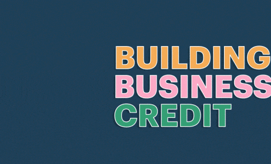The phrase "building business credit" is next to a tower of 3 blocks that fall into place, symbolizing building business credit.