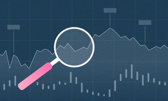 Magnifying glass looking at chart