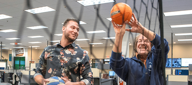 Men playing basketball