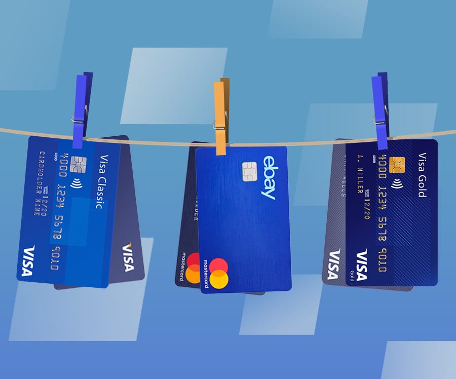 Line of business credit cards hanging by clothespins.