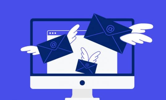 Email envelopes with wings flutter off a computer screen.