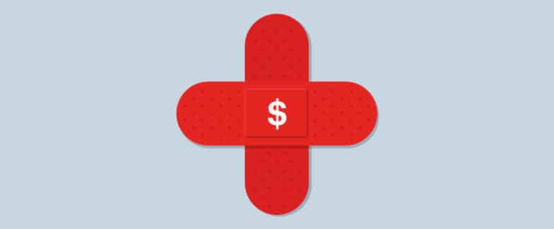 Two red bandages placed together in the shape of a cross with a dollar sign in the middle