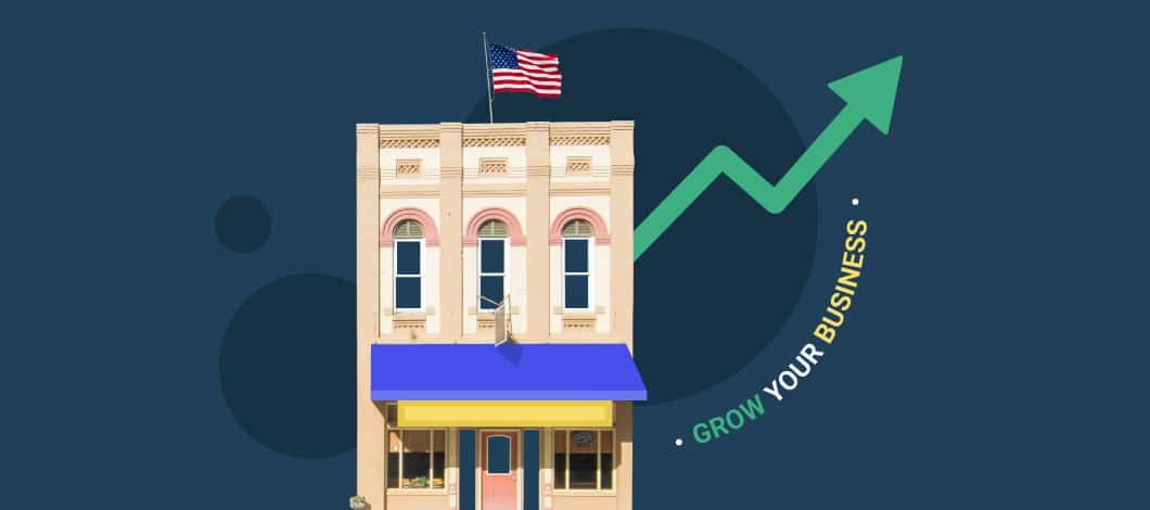 An image of a building with an American flag at the top and the words “Grow Your Business” to the side