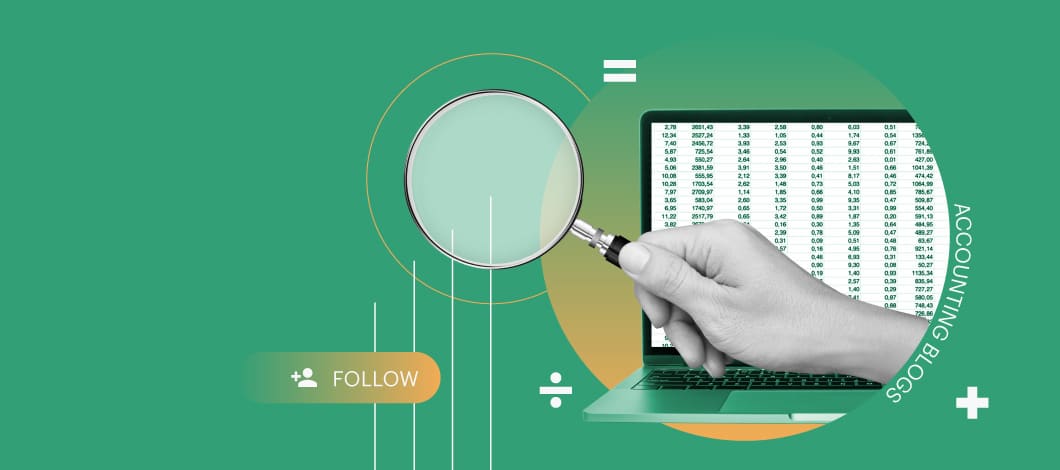 A hand holds a magnifying glass next to a laptop displaying a spreadsheet.