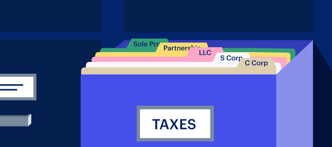 A filing cabinet drawer labeled “taxes” is open, folders are named with different types of business organizations.