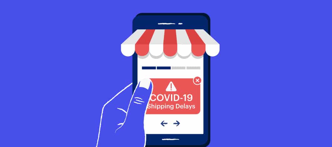 A hand holds a smartphone. The screen reads, “COVID-19 Shipping Delays.”