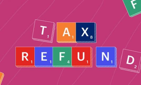 Word tiles spell out “tax refund.”