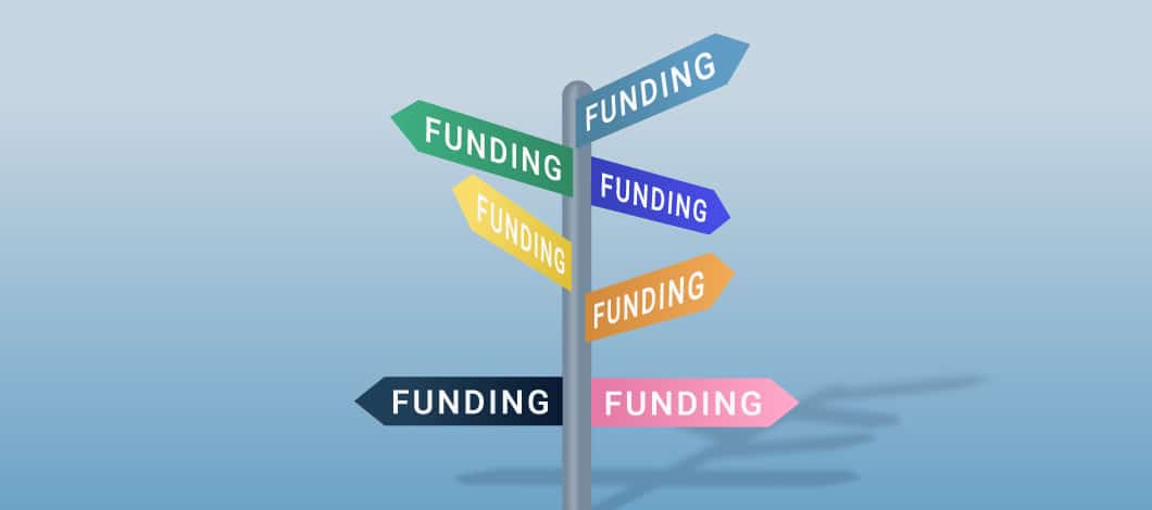 Multiple signs with the word “funding” pointing in different directions