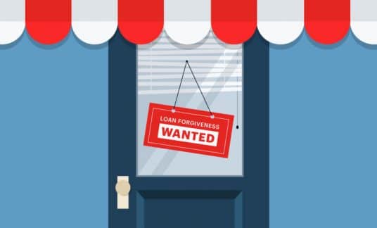 The door of a small shop has a sign that reads, “Loan Forgiveness Wanted.”