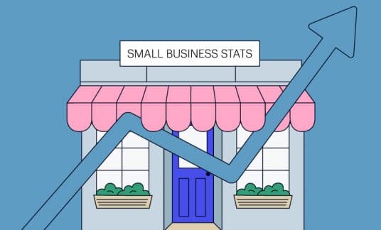 A small business shop stands as the backdrop for a bar chart line showing an upward trend.