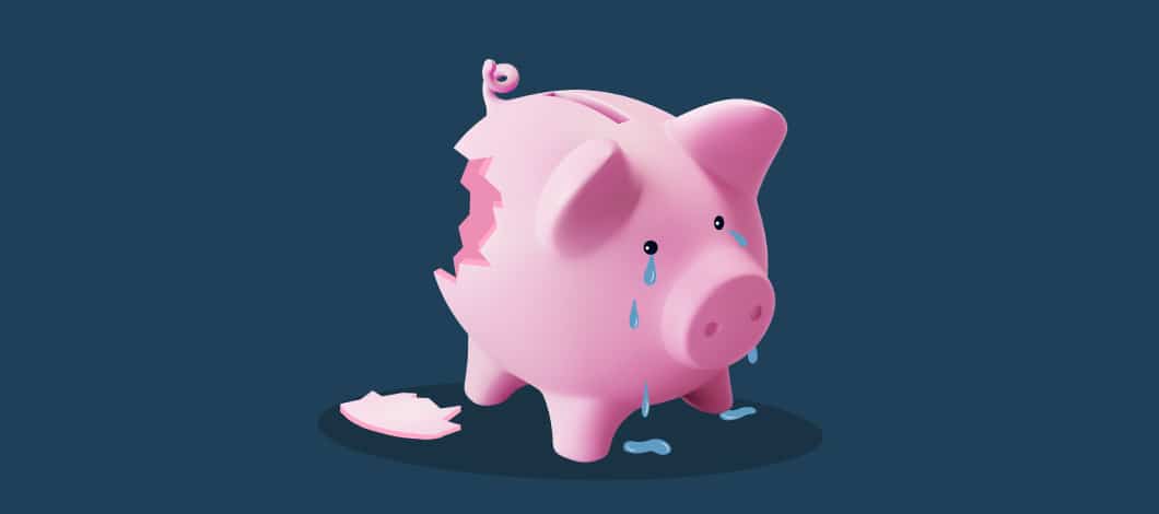 A broken piggy bank sheds tears.