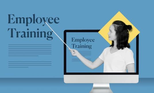 An instructor pops out of a computer screen and points to the words “Employee Training.”