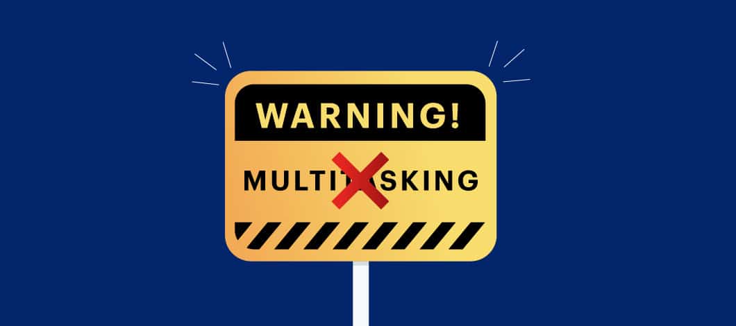 A warning sign with the word “Multitasking” crossed out.