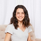 Photo of a smiling Alyssa Petersel, CEO and founder of MyWellbeing.