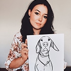 Laura Connelly holding a sketch of a dog