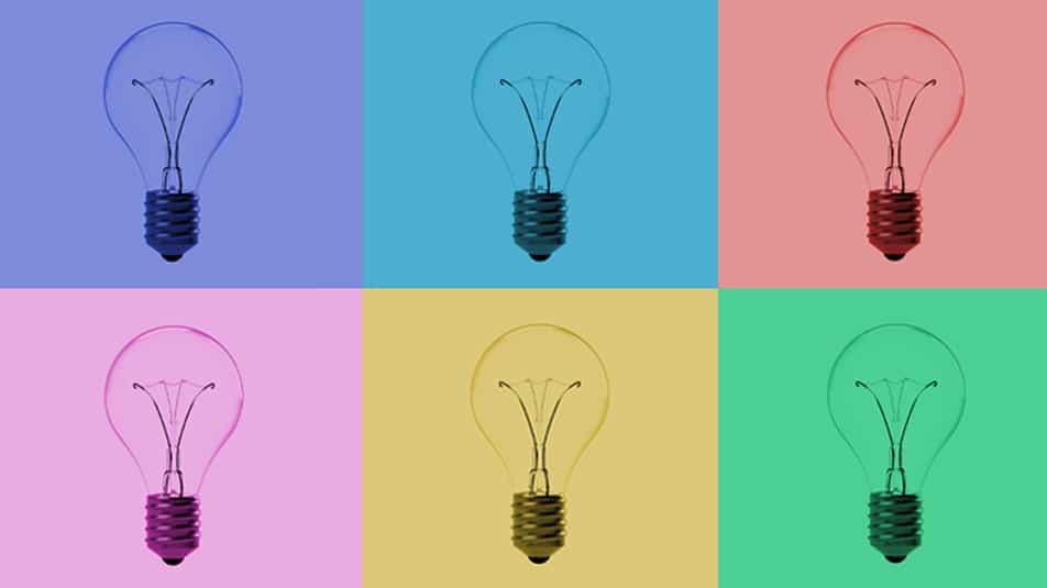 lightbulbs against multi-colored blocks.