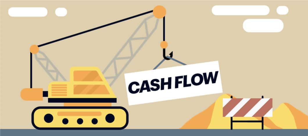 A crane lifts the words “Cash Flow” at a construction site.