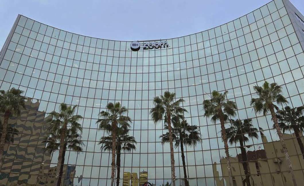 Photo of Zoom company building with palm trees in front