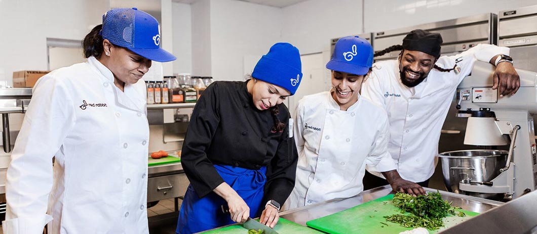 Photo of Red Rabbit team members in a commercial kitchen