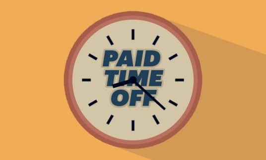 A wall clock has the words “Paid Time Off” on its face.