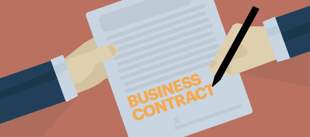 A person holds and signs a form labeled “Business Contract.”