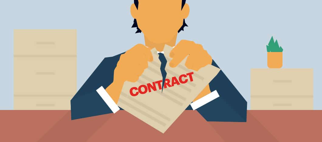 A person sitting at a desk tears up a document labeled “Contract.”