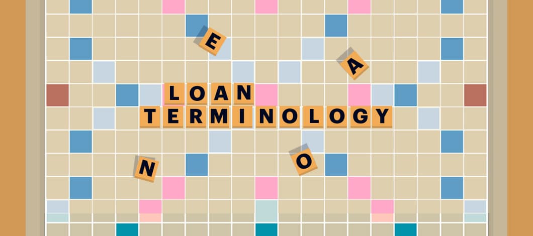 Scrabble letters on a game board spell out “Loan Terminology.”