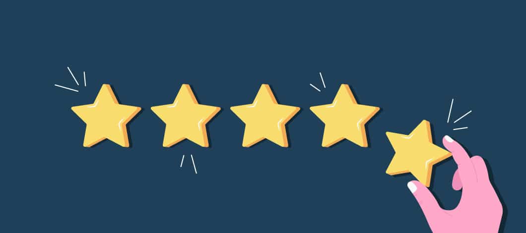 There are 4 stars suspended in a row. A hand raises up to hang a 5th star.