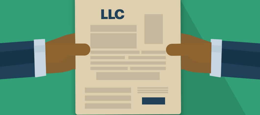 Hands hold a blank form with the header “LLC” at the top.