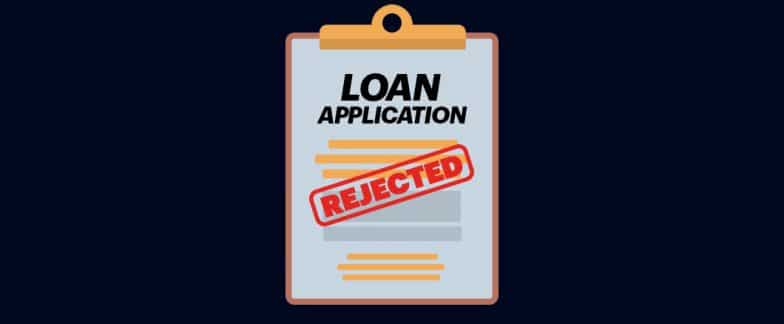 A form labeled “Loan Application” has been stamped with the word “Rejected” in red ink.