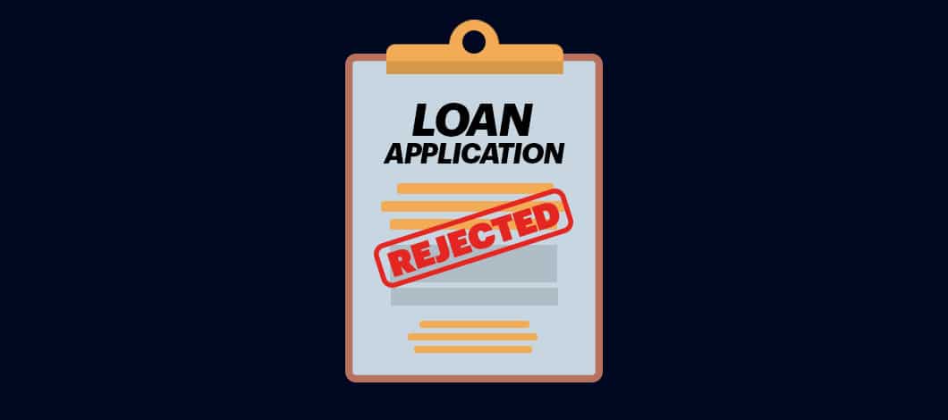 A form labeled “Loan Application” has been stamped with the word “Rejected” in red ink.