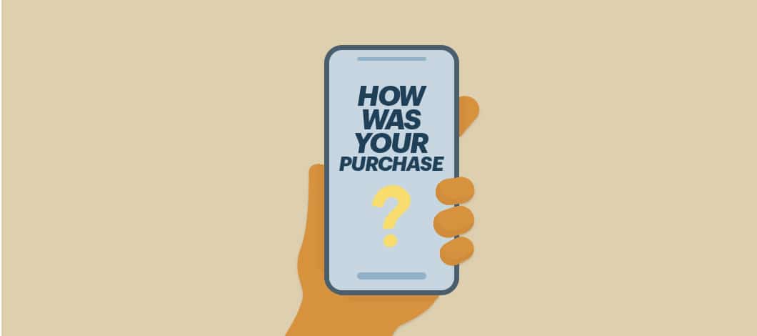 A hand holds a smartphone whose screen reads, “How was your purchase?”