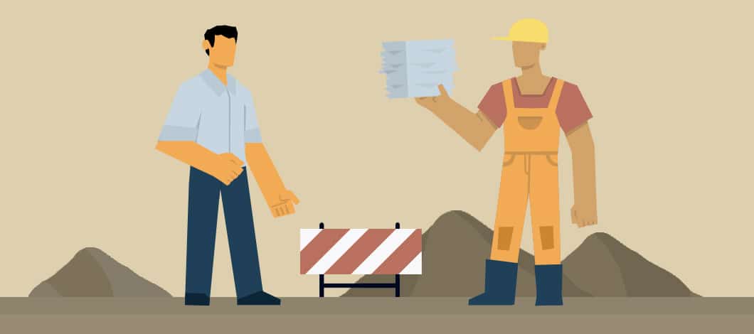 At a construction site, a contractor wearing a hard hat hands a stack of pay applications for construction to a business person.