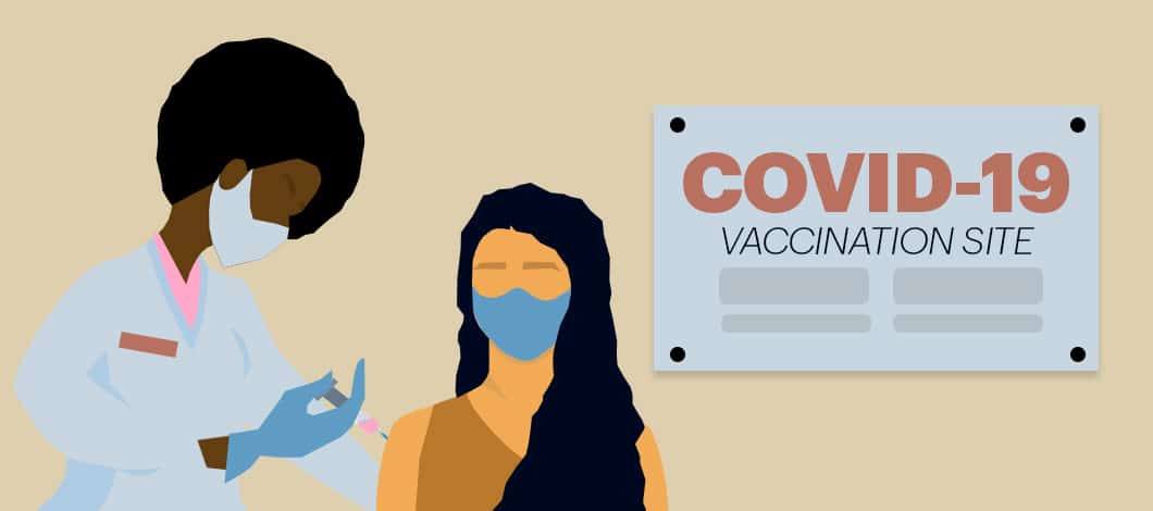 A masked person is about to get a shot from a masked medical professional. The background reads “COVID-19 Vaccination Site.”