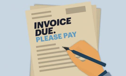 A hand with a pen drafts a letter that reads “Invoice Due. Please Pay.”