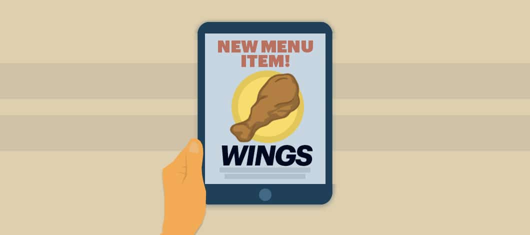 A digital restaurant ad is featured on a tablet. It reads “New Menu Item! Wings.”